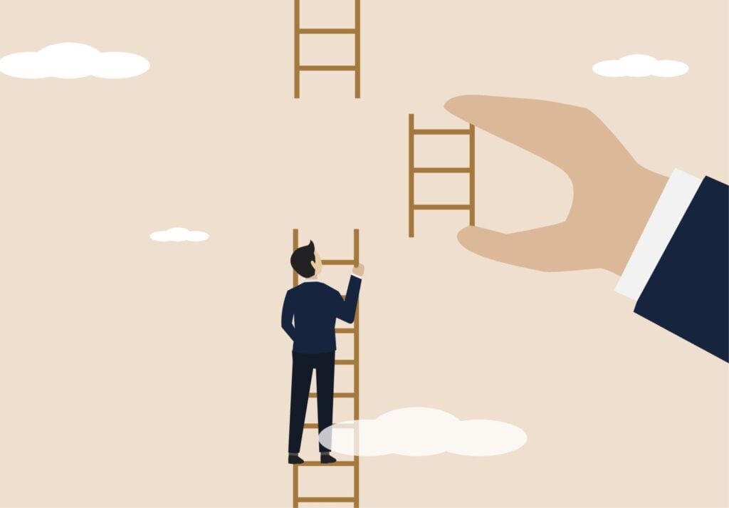 businessman helped by big hand to climb ladder