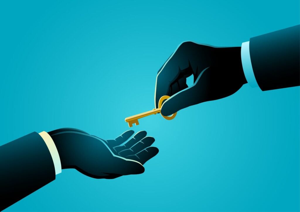 Businessman Silhouette Hand Giving Golden key