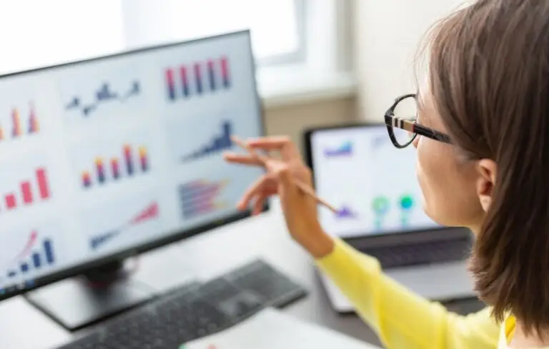 woman with data dashboard graphs