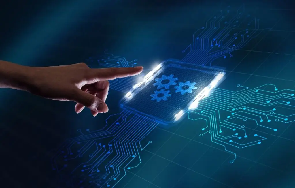 Hand reaching towards digital screen displaying gears