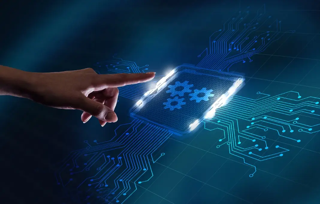 Hand reaching towards digital screen displaying gears