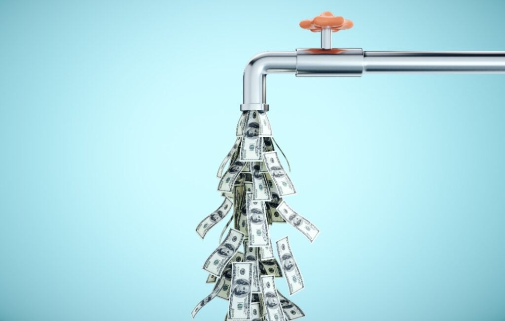 Faucet with dollar bills