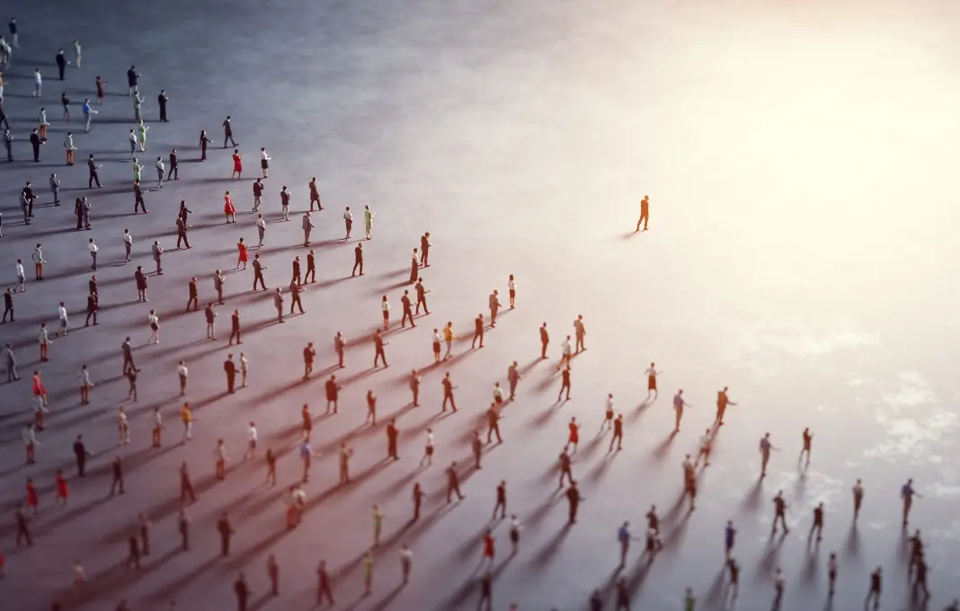 A crowd of people following one leader